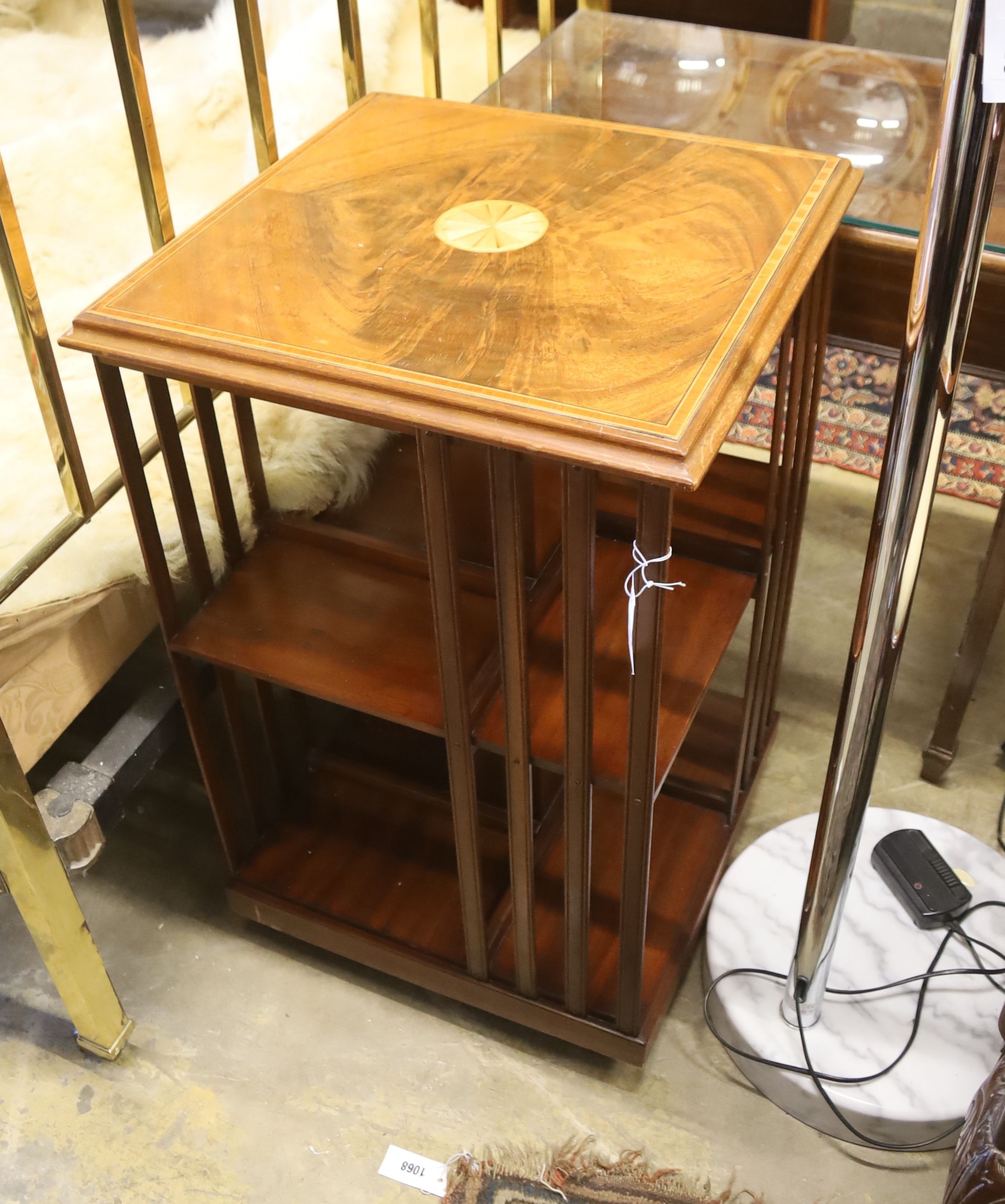 A reproduction Edwardian design inlaid mahogany revolving bookcase, width 49cm, height 80cm